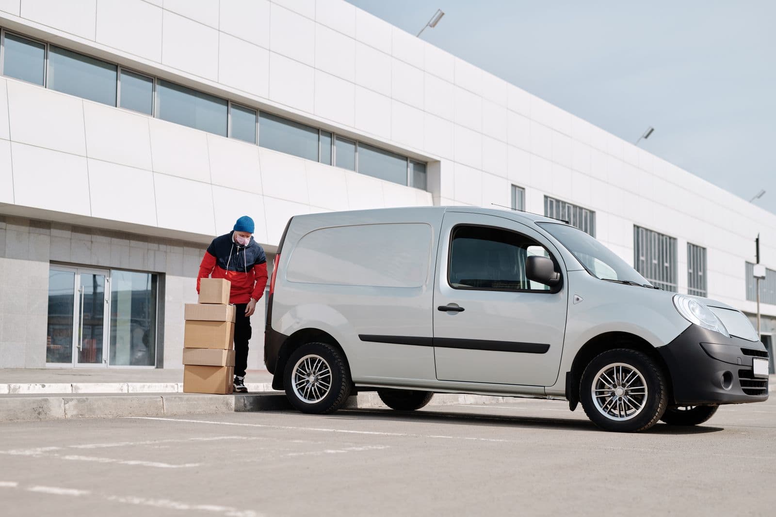 Delivery van being loaded with packages for transport