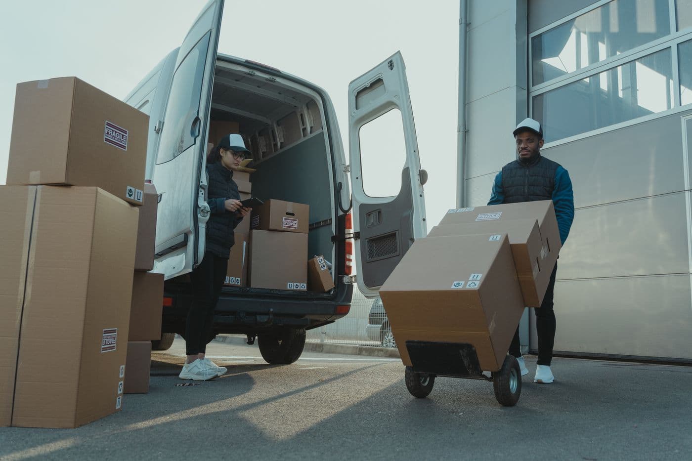 Delivery team carefully loading packages into a van
